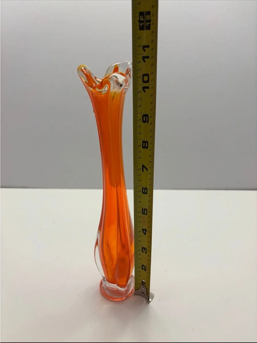 Vintage orange and clear glass swung bud vase